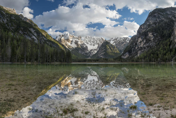 Carbonin, Dolomites, South Tyrol, Italy. Lake Landro with the peaks of the Cistallo group at sunset