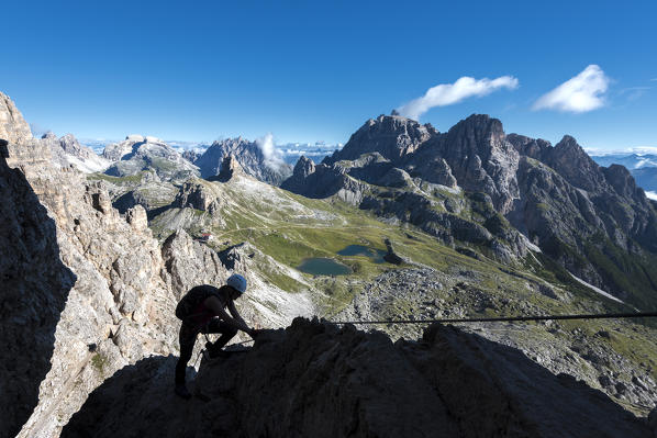 Sesto/Sexten, Dolomites, South Tyrol, province of Bolzano, Italy. Climber on the via ferrata De Luca-Innerkofler to the summit of Monte Paterno