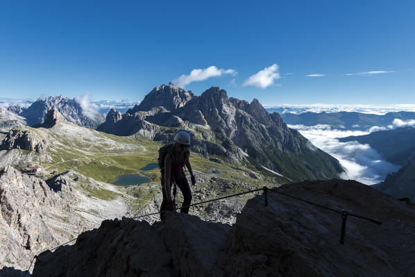 Sesto/Sexten, Dolomites, South Tyrol, province of Bolzano, Italy. Climber on the via ferrata De Luca-Innerkofler to the summit of Monte Paterno