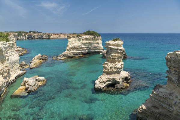 Melendugno, province of Lecce, Salento, Apulia, Italy. The Faraglioni in Torre Sant'Andrea