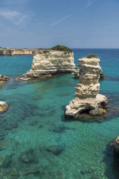 Melendugno, province of Lecce, Salento, Apulia, Italy. The Faraglioni in Torre Sant'Andrea