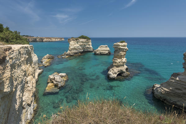 Melendugno, province of Lecce, Salento, Apulia, Italy. The Faraglioni in Torre Sant'Andrea