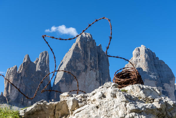 Sesto / Sexten, province of Bolzano, Dolomites, South Tyrol, Italy. Barbed wire from the First World War in front of the Three Peaks of Lavaredo