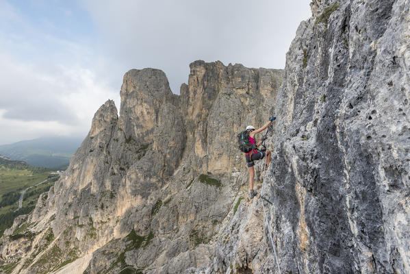 Col dei Bos, Cortina d'Ampezzo, province of Belluno, Veneto, Italy. Climber on the via ferrata degli Alpini