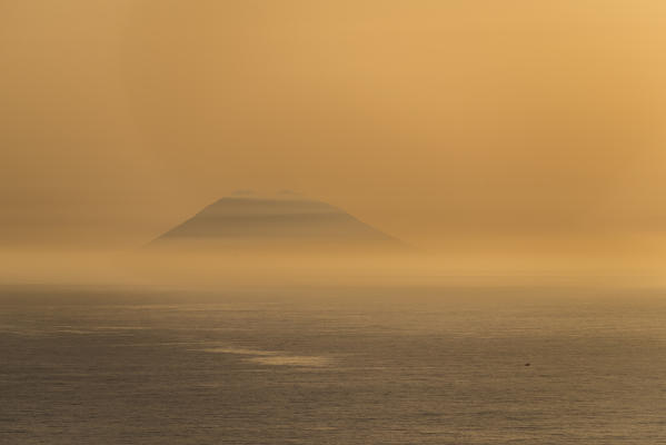 Zambrone, province of Vibo Valentia, Calabria, Italy, Europe. Sunset in Zambrone with a view of the Stromboli volcano