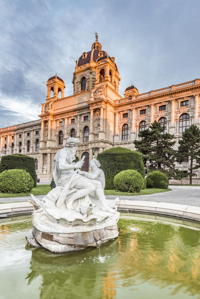 Vienna, Austria, Europe. Tritons and Naiads fountain on the Maria Theresa square with the Natural History Museum in the background
