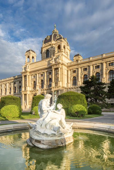 Vienna, Austria, Europe. Tritons and Naiads fountain on the Maria Theresa square with the Natural History Museum in the background