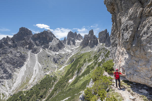 Misurina, Cadini mountains, Dolomites, province of Belluno, Veneto, Italy. A mountaineer on the mountain trail 