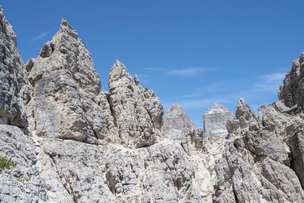 Misurina, Cadini mountains, Dolomites, province of Belluno, Veneto, Italy. Mountaineers on the mountain trail 