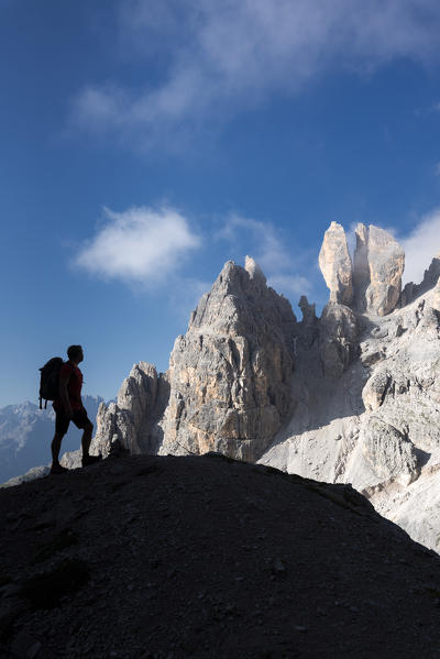 Cristallino di Misurina, Misurina, Dolomites, province of Belluno, Veneto, Italy. A climber admired the Campanile Dibona, also called lobster claw