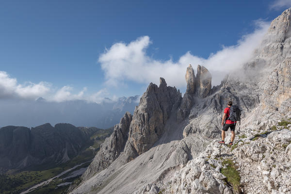 Cristallino di Misurina, Misurina, Dolomites, province of Belluno, Veneto, Italy. A climber admired the Campanile Dibona, also called lobster claw