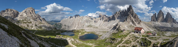 Sesto / Sexten, province of Bolzano, Dolomites, South Tyrol, Italy. Panoramic view at the Tre Cime di Lavaredo, lakes Piani, Mount Paterno and refuge Locatelli