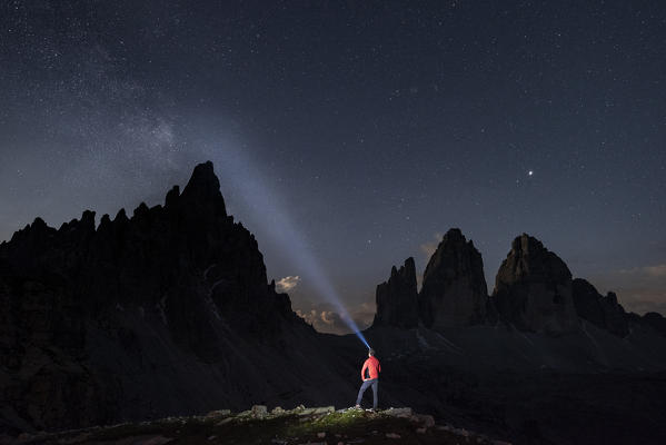 Sesto / Sexten, province of Bolzano, Dolomites, South Tyrol, Italy. A hiker admires the starry sky (MR)