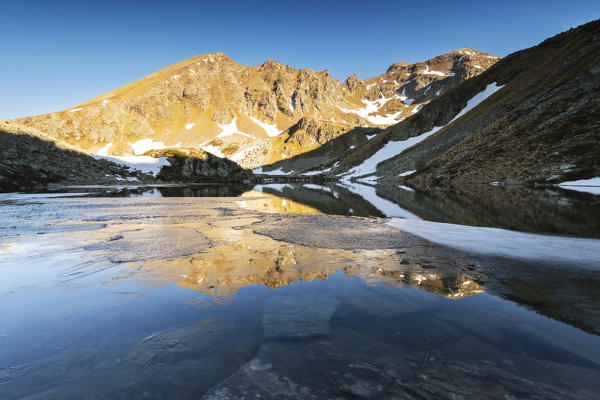 Grom lake at dawn In Stelvio national park, Brescia province, Lombardy district, Italy, Europe