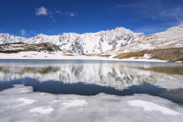 Lago Nero at thaw in Gavia pass, Brescia province, Lombardy district, Italy, Europe