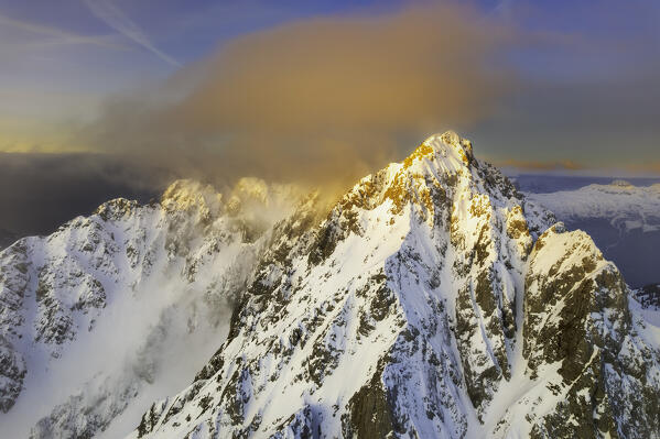 Landscape of Italian Alps in Winter season, Aerial view from Pizzo Camino group during a sunrise, Brescia province, Vallecamonica in Italy, Europe.