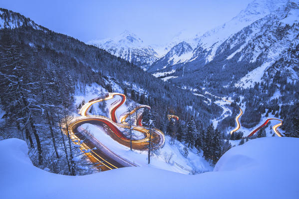 Car lights at night, Maloja Pass, Engadin, canton of Graubunden, Switzerland