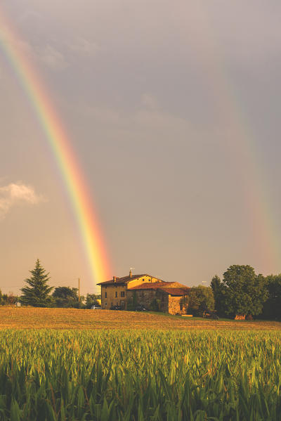 Rainbow in Franciacorta at sunset, Lombardy district, Brescia province, Italy.