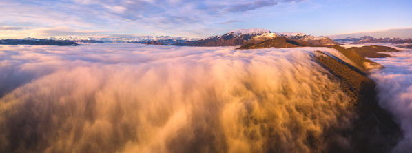 Sunset over the fog, Lombardy district, Brescia province, Italy