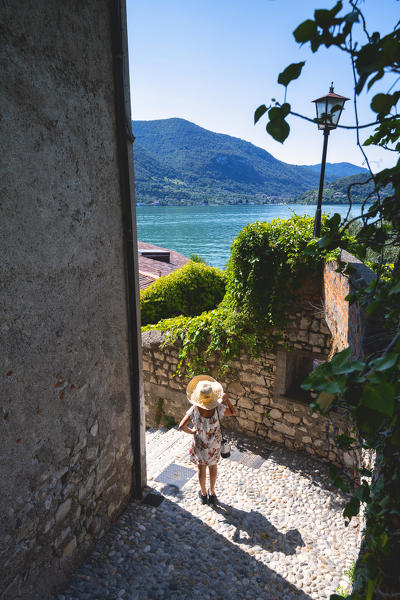 Tourist in the streets of Peschiera Maraglio, Monteisola, Brescia province, lombardy district, Italy.