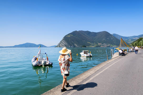 Tourist in the streets of Peschiera Maraglio, Monteisola, Brescia province, lombardy district, Italy.