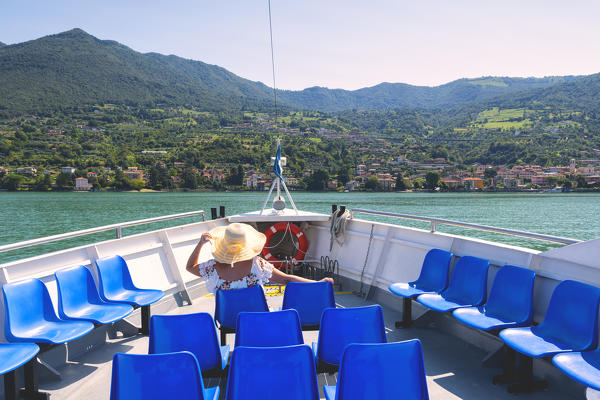 Tourist on the boat to MonteisolaBrescia province, lombardy district, Italy.
