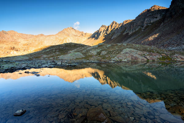 Sunrise in Ercavallo lake, Vallecamonica, Brescia province, Lombardy district, Italy.