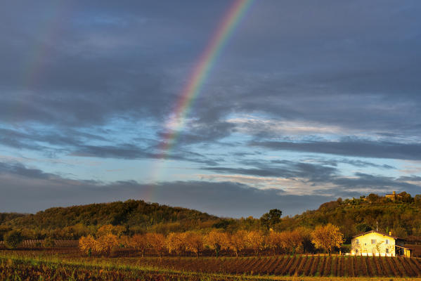 Rainbow at dawn in Franciacorta, Brescia province, Lombardy district, Italy.