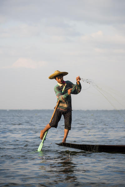 Inle lake, Nyaungshwe township, Taunggyi district, Myanmar (Burma). Local fisherman on the edge of the boat.