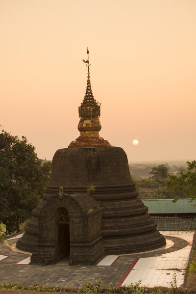 Mrauk-U, Rakhine state, Myanmar. Stupa with setting su in the background.