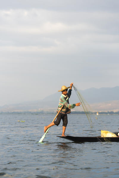 Inle lake, Nyaungshwe township, Taunggyi district, Myanmar (Burma). Local fisherman on the edge of the boat.
