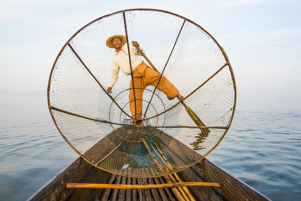 Inle lake, Nyaungshwe township, Taunggyi district, Myanmar (Burma). Local fisherman with typical conic fishing net.