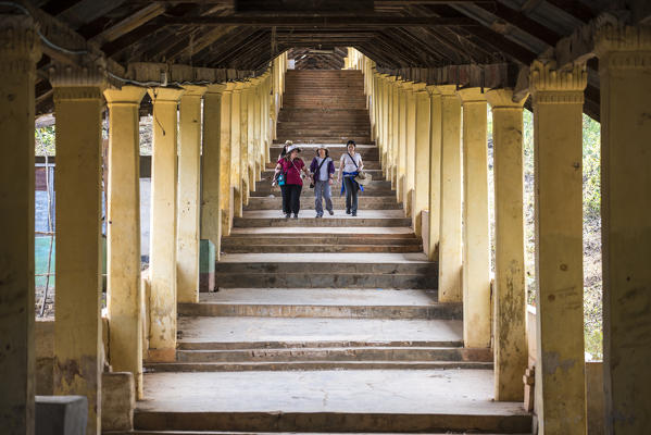 Inlay Lake, Shan State, Myanmar. People walking in a pagoda.