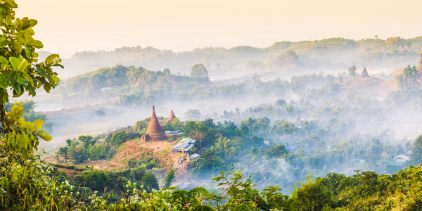 Mrauk-U, Rakhine state, Myanmar. Mrauk-U valley in a foggy sunrise seen from the Shwetaung pagoda.