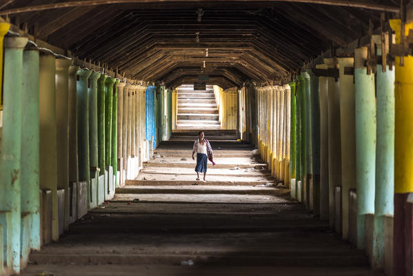 Inlay Lake, Shan State, Myanmar. Man walking in a pagoda.