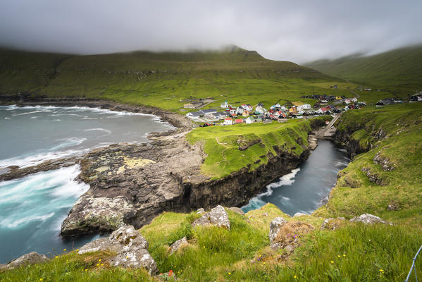 Gjogv, Eysturoy island, Faroe Islands, Denmark. Village and its natural harbor.