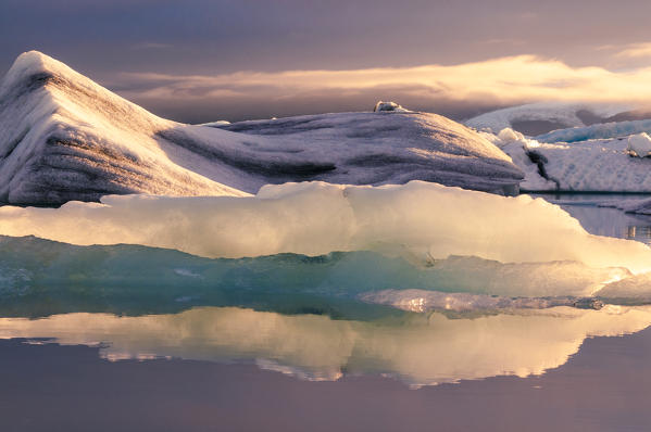 Jokulsarlon glacier lagoon, Iceland. Blocks of ice floating in the lagoon at sunset.