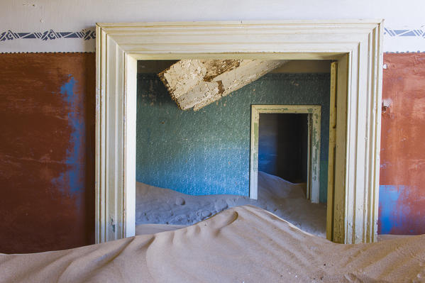 Kolmanskop, Southern Namibia, Africa. Old abandoned mining town's houses with sand.