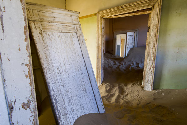 Kolmanskop, Southern Namibia, Africa. Old abandoned mining town's houses with sand.