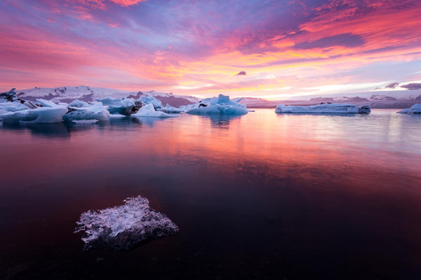 Icebergs and ice chunk at sunset, Jokulsarlon Glacier Lagoon, Iceland