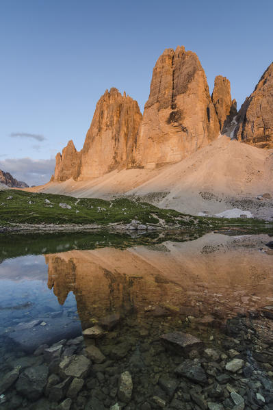 LangalmTre Cime di Lavaredo, Three peaks of lavaredo, Drei Zinnen, Dolomites, South Tyrol, Veneto, Italy. Tre Cime di Lavaredo are reflected in lake