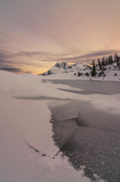 Bivera mount, Casera Razzo, Carnia, Dolomites, Veneto, Italy. Frozen lake at Casera Razzo