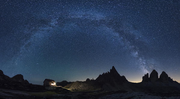 Tre Cime di Lavaredo, Drei Zinnen, Three Peaks of Lavaredo, Dolomites,Veneto, South Tyrol, Italy. Milky Way's arch over Tre Cime di Lavaredo