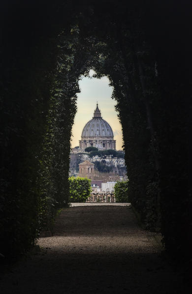 Rome, Lazio, Italy. The Papal Basilica of St. Peter in the Vatican seen from the keyhole of a door.