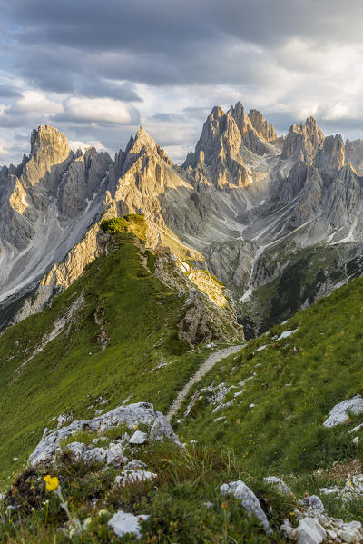 Italy,Veneto,Belluno district,Auronzo di Cadore,a man surrounded by the peaks of Cadini di Misurina