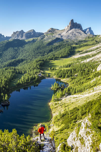 Italy,Veneto,Belluno district,Cortina d'Ampezzo,a hiker admires the Federa lake from an elevated view point  (MR)