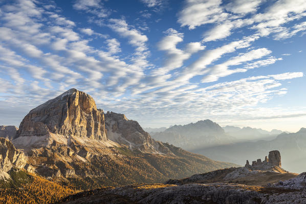 Italy,Veneto,Belluno district,Cortina d'Ampezzo,the south wall of Tofana di Rozes and the silhouette of Cinque Torri in fall season