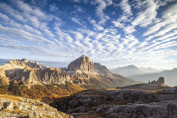 Italy,Veneto,Belluno district,Cortina d'Ampezzo,the Fanis group,the south wall of Tofana di Rozes and the silhouette of Cinque Torri in fall season