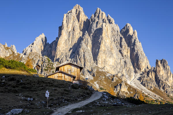 Italy,Veneto,Belluno district,Auronzo di Cadore,the sun lights the Città di Carpi hut,located at the base of Cadin di San Lucano