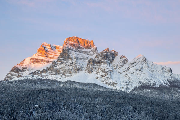 Italy,Veneto,Belluno district,Boite Valley,Borca di Cadore,the first light of sun hits Mount Pelmo